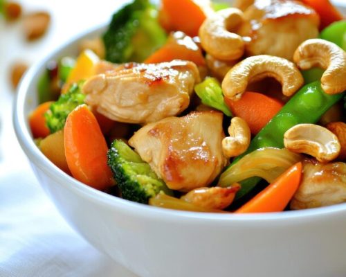colorful-bowl-stirfried-chicken-vegetables-garnished-with-cashews-showcasing-healthy-appetizing-meal_490636-27516