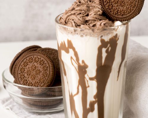high-angle-glass-dessert-with-chocolate-biscuits