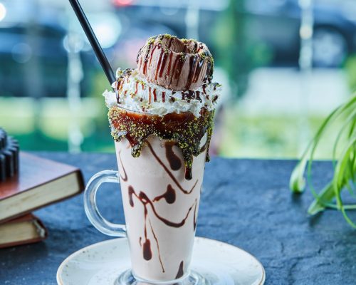 milkshake-with-cone-chocolate-sprinkles-books-dark-surface (2)